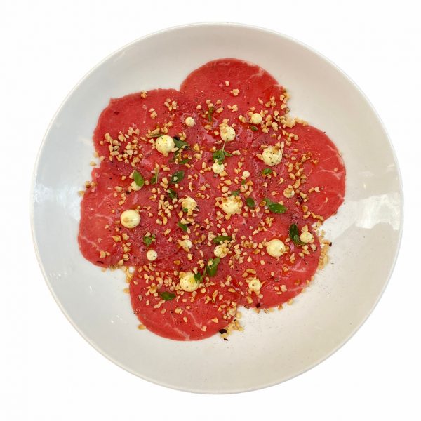 Carpaccio di manzo, maionese, nocciole e maggiorana Enoteca Marcucci consegna a domicilio con Cosaporto