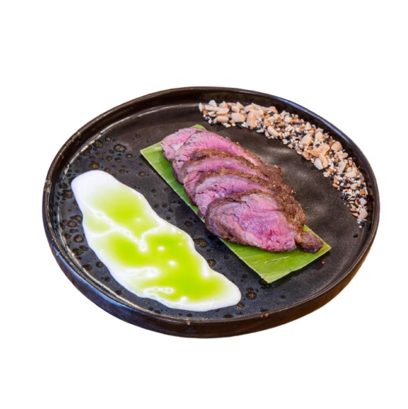 Pluma di Maiale al Pro-Fumo di Melo, Semi Croccanti e Suero Costeño Carnal Express consegna a domicilio con dev.cosaporto.it